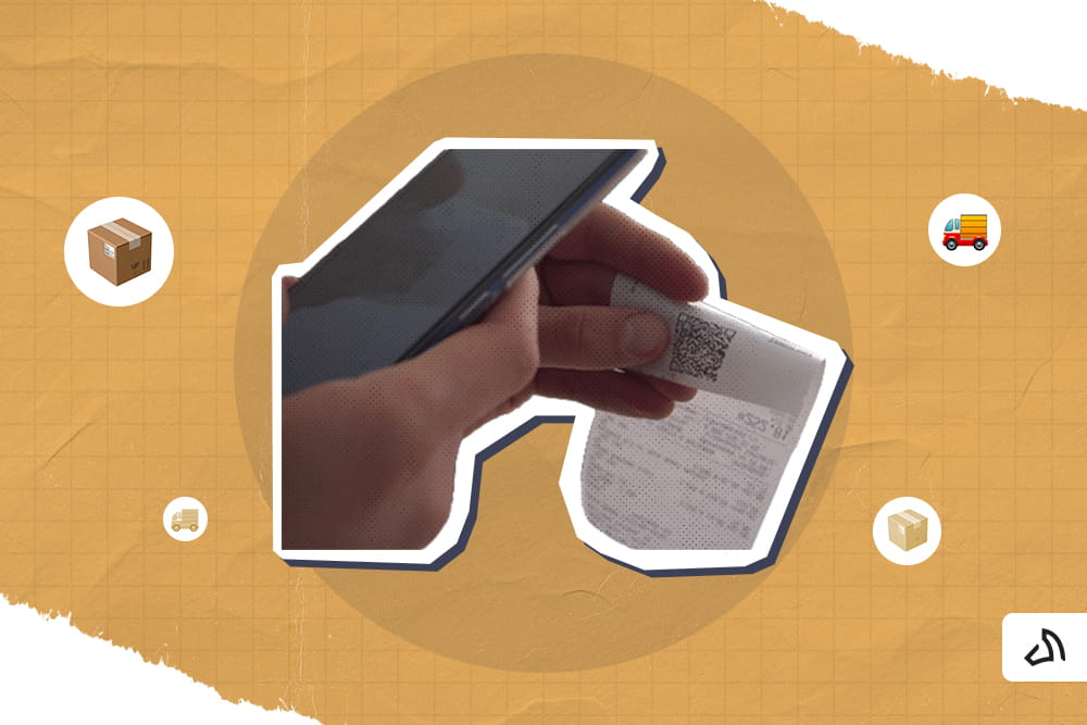 A person holding a phone while scanning the QR code of a receipt