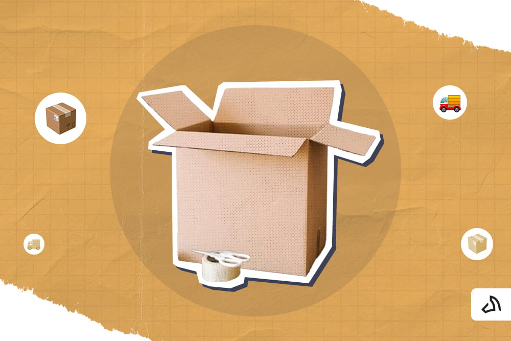 A large open brown box with a cellulose tape and scissors outside