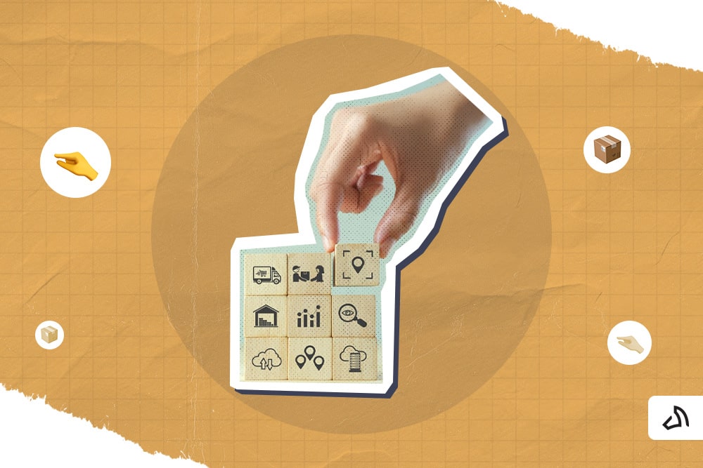 A hand is arranging blocks with various icons.