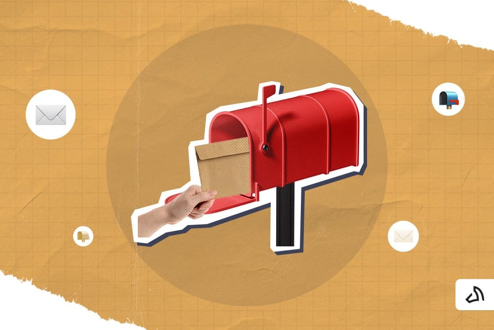 A hand inserting a brown envelope inside a red mail box
