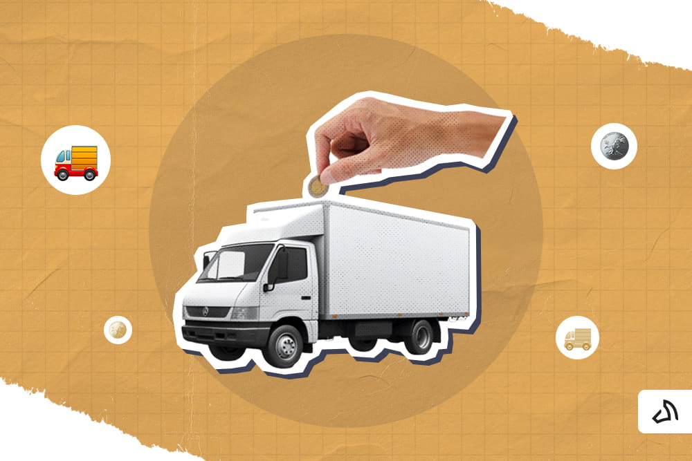 A hand is inserting a coin inside a white delivery truck
