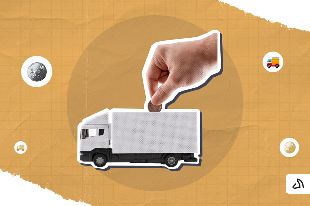 Une main insère une pièce à l’intérieur d’un camion de livraison blanc
