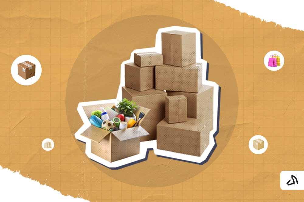 A box filled with various goods in front of a pile of carton boxes. 