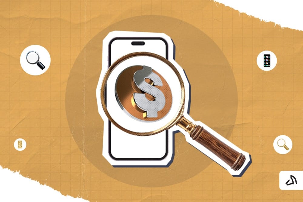 A magnifying glass with a dollar sign viewing a mobile phone