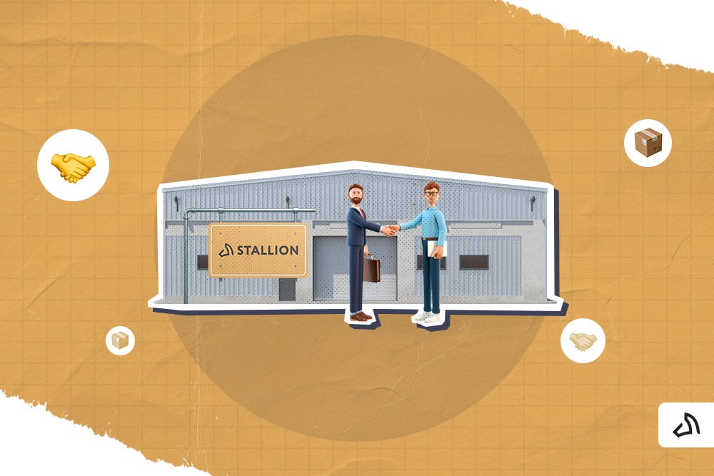 Two people are shaking hands together in front of the Stallion warehouse.