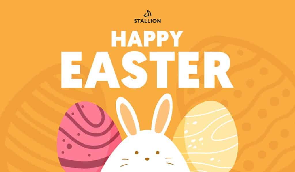 An Easter bunny in between two coloured eggs