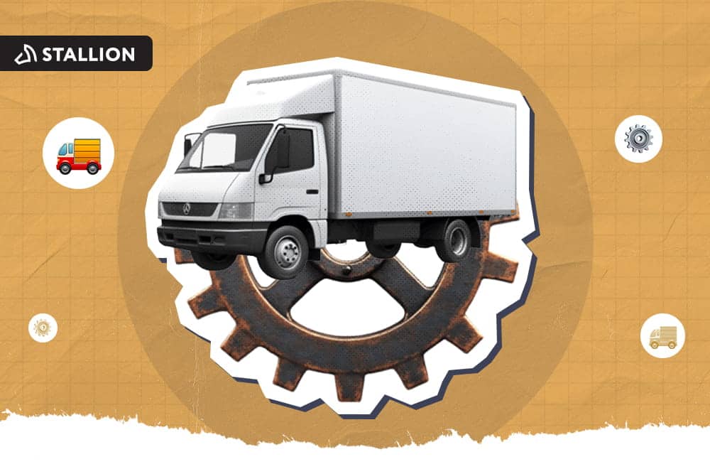 A white delivery truck is on top of a metal gear cog