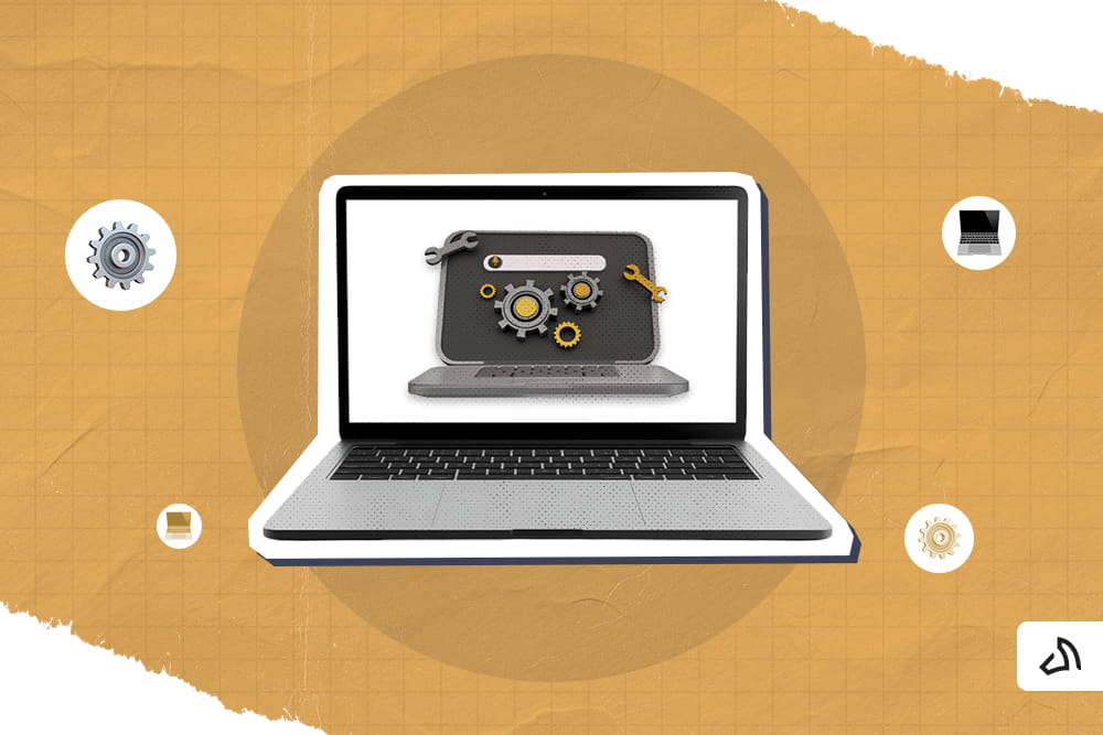 A laptop with a gear cog on the bigger laptop's screen